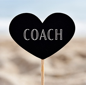 Coach displayed on a heart-shaped sign