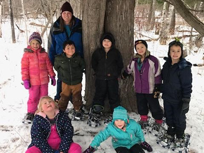 lady with students with snowshoes on